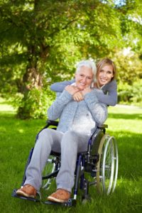 disabled woman in wheelchair being hugged